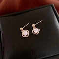 Golden clover stud earrings featuring elegant white pearls on a black leather display - Gold Rhombus Four-Leaf Clover