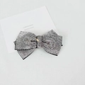 Close-up of elegant bow hair clip with sparkling silver rhinestones on black metal base - 8cm Medium Cross Flat Waist White Rhinestone