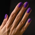 Glossy deep purple press-on nails in medium square shape shown on hand model - Dark Purple