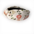 Detail of knot design on beige floral fabric headband with birdcage and leaf pattern - Lucky Bird Floral