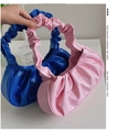 Detail view of pink and blue ruched cloud bags featuring flexible PU leather textures - Dark Blue