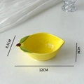 Detailed dimensions of a yellow lemon-shaped ceramic sauce dish on a white background - Lemon