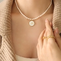 French style pearl necklace with Aquarius zodiac shell pendant and golden metal charm - Aquarius