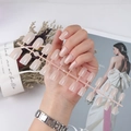 Long square glossy nude press-on nails set with UV top coat shown on hand in elegant scene - Nude (CFL-07)