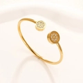 Elegante bracciale rigido in acciaio al titanio dorato con zirconi incastonati sui cerchi - 26 Oro