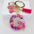 Detail of resin letter G keychain with pink stones, rose tassels and golden butterfly charm - Rose Red Butterfly Tassel Clip / Letter G