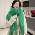 Oversized bright green knit scarf with thick tassels paired with a beige wool coat - Solid Grass Green