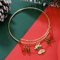 Adjustable gold Christmas bracelet featuring red bell charm and festive beads - Holly Bell (D1372)