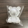 White astronaut bear night light figurine in transparent packaging on wood background - Small Star Bear Silver
