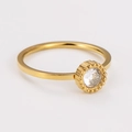 Detailed macro view of gold plated stainless steel ring with round zircon and beaded edge - Gold Round Zirconia