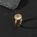Macro shot of evil eye adjustable ring featuring blue and white zircon pavé setting - G-Radial Blue Gem Disc