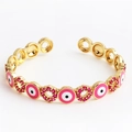 Gold open cuff bangle featuring pink enamel evil eye charms and pink zircon micro-paving - Round Rose Red