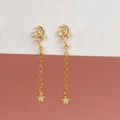 Close-up of gold tassel earrings with crescent moon, stars and pink zircon inlay - Star Moon Zirconia Tassel Earrings