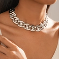 Close-up of thick silver metal link chain necklace worn on neck with polished finish - Necklace - Silver