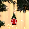 Close-up of wooden gnome ornament with plaid hat hanging on a Christmas tree branch - Braid Style