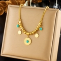 Golden snake chain necklace featuring a turquoise sun pendant and small round charms - Sun Motif Turquoise Snake Chain (N1822)