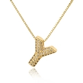 Macro view of gold letter Y pendant with micro-paved sparkling cubic zirconia on box chain - Letter Y