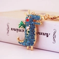 Portachiavi dinosauro dorato con strass blu e ali verdi per chiavi dell'auto - Blu