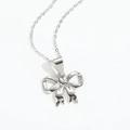 Close-up of elegant silver bow pendant necklace with polished metal texture finish - Bow (Silver) XL3506