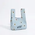 Light blue knitted handbag featuring white bear patterns and a stylish U-shaped handle - Bear Head Blue