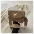 Detail of heart-shaped metal buckle and embroidery on khaki crossbody saddle bag - Khaki