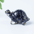 Miniature blue goldstone turtle figurine with clear limbs on a plain white background - 07 Blue Sandstone + Gold Foil
