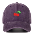 Close-up of cherry embroidery and washed cotton fabric on retro purple baseball cap - Purple