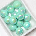 Mint green iridescent acrylic beads in a white tray for DIY jewelry making and crafts - Light Green