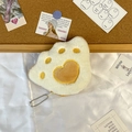 Flat lay of soft plush cat paw coin purse with embroidery on silk and cork background - Brown