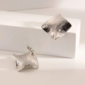 Modern irregular square studs in silver finish with hammered and cross-etched textures - Leather Texture Square / Steel