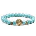 Blue turquoise beaded bracelet with golden lion head charm and textured round beads - Blue Turquoise + Gold