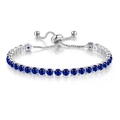 Macro detail of adjustable 4mm silver tennis bracelet featuring blue zircon claw settings - Silver - Sapphire Blue
