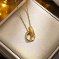 Elegant gold double interlocking ring necklace with sparkling zircon pavé on a gift box - 8976 Golden Double Rings