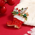 Golden Christmas stocking brooch with red rhinestones and green enamel leaf accents - BR1400 Red Christmas Sock