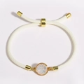 Adjustable beige braided rope bracelet with golden accents and opal-style charm - White