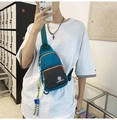 Water-resistant blue crossbody chest bag with orange zippers on a fashion model - Blue