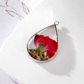 Teardrop resin pendant with red dried rose and gold foil in silver metal frame - Red Flower Teardrop