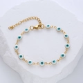 Pulsera de ojo turco de acero inoxidable dorado con esmalte azul sobre piedra - Blanco