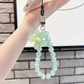Detail of light blue beaded phone strap with a green flower charm and silver clasp - Green Flower Green Beads