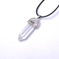 Detail of transparent hexagonal crystal point pendant with polished silver metal bail - Clear White