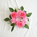 Close-up of artificial pink rose candle ring with green leaves for festive decoration - Deep Pink