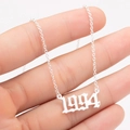 Detailed view of silver stainless steel 1994 birth year number pendant necklace - 1994 / Steel