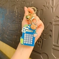 Blue calculator keychain with brown bear doll, golden bell and lucky RICH lucky text - Animal Trendy Computer - Joy Bear