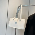 White vintage large capacity shoulder bag with gold metal buckle on silver rack - White