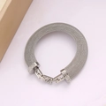 Detailed shot of silver mesh bracelet featuring H-shaped clasp with clear crystal accents - YS855 Steel Color Bracelet