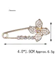 Elegante spilla a farfalla dorata con zirconi incastonati, misura 4,0x1,9 cm - Quadrifoglio