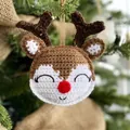 Handmade crochet reindeer Christmas tree ornament with red nose and festive brown yarn details - Elk
