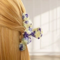Detail of purple and green marble pattern flower hair claw clip on model hair - Style D Arch (Purple-Green Marble)
