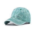 Close-up of mint green washed denim baseball cap with vintage distressed ripped details - Adjustable / Denim Dark Green
