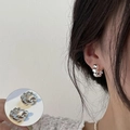 Elegant silver twisted hoop earrings with a polished finish for a stylish, modern look - Silver Twist Hoop